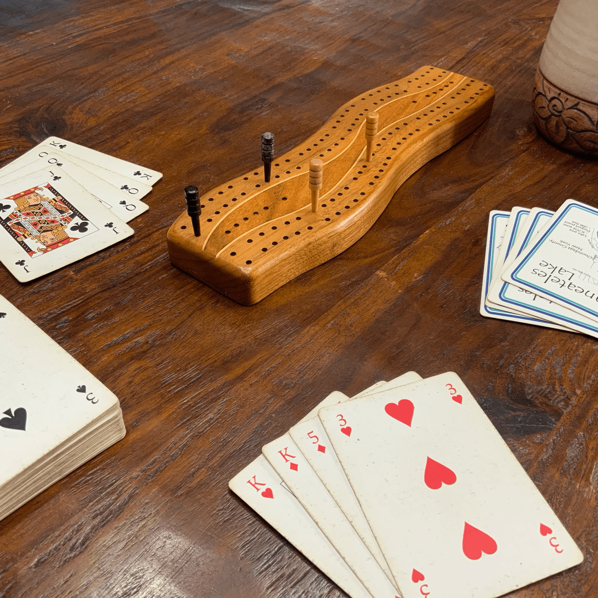 Cribbage board and playing cards